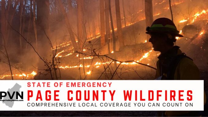 Page County declared a local emergency after multiple wildfires broke out. Pictures shows flames behind a woodland firefighter in Shenandoah National Park.